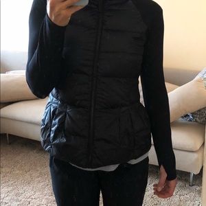 One piece, long sleeve down vest.